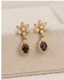 Gold Finish Floral CZ Drop Earrings with Black Teardrop Stone