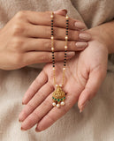 Gold-Toned Mangalsutra with Lakshmi Pendant & Green Stone Detailing