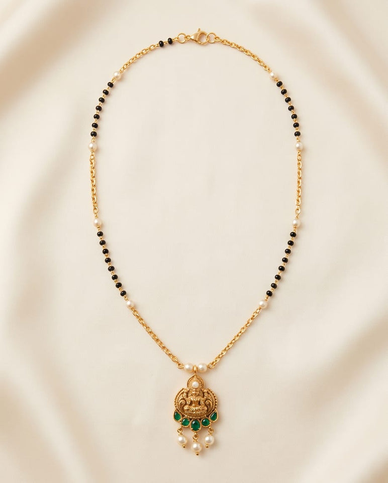 Gold-Toned Mangalsutra with Lakshmi Pendant & Green Stone Detailing